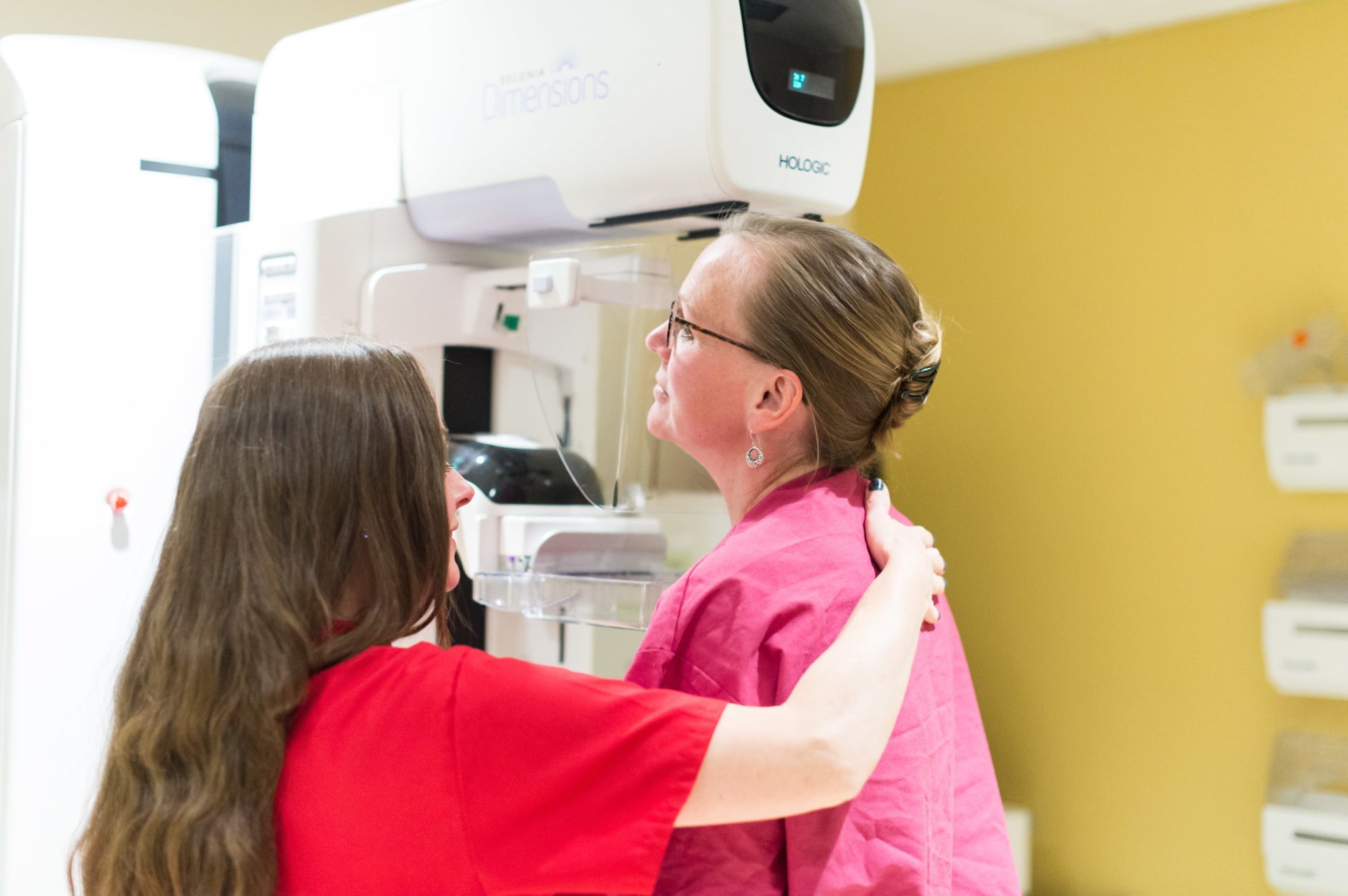 A Radiologic Technologist positioning a patient for a mammogram 