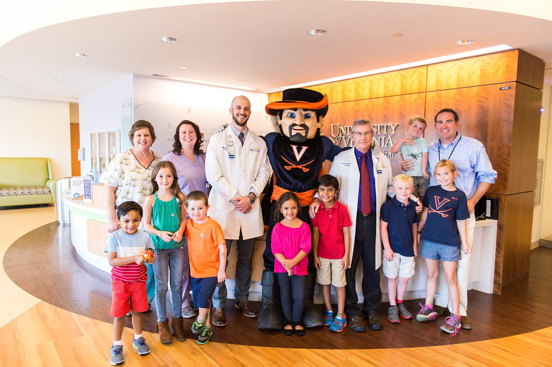 UVA Cavman and pediatric radiologists stand with children and parents