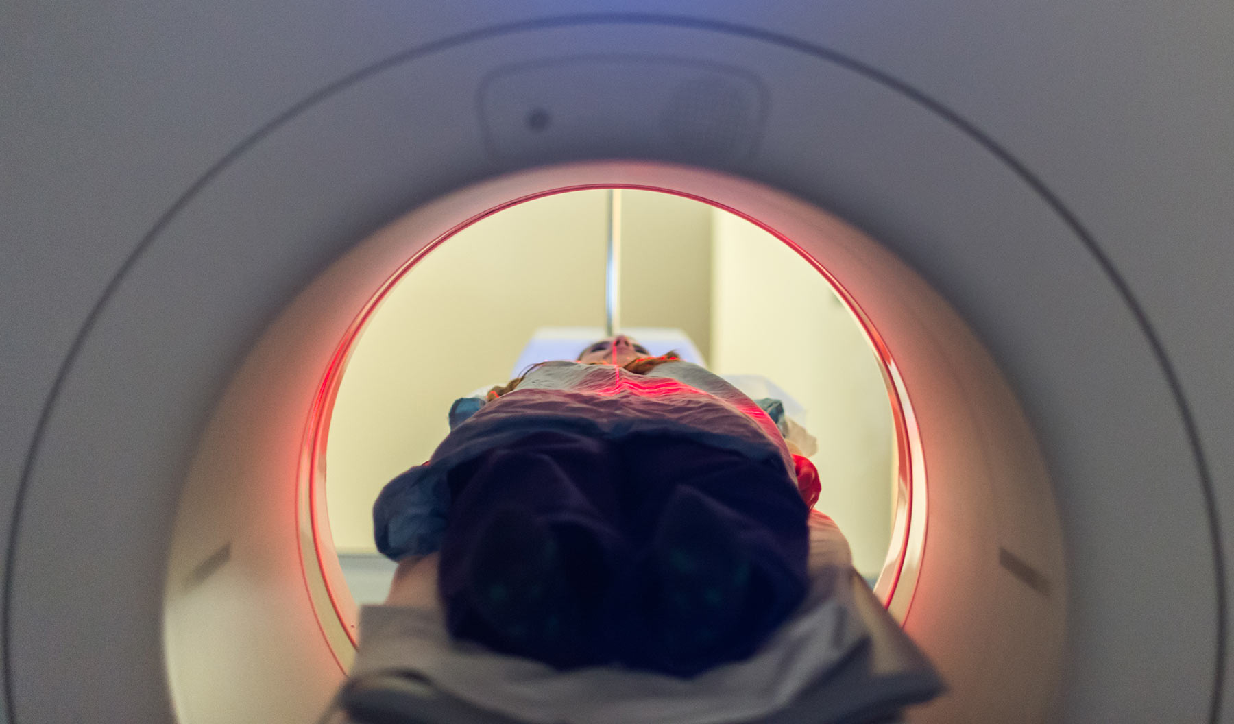 Internal shot of a patient entering into a CT scanner feet-first