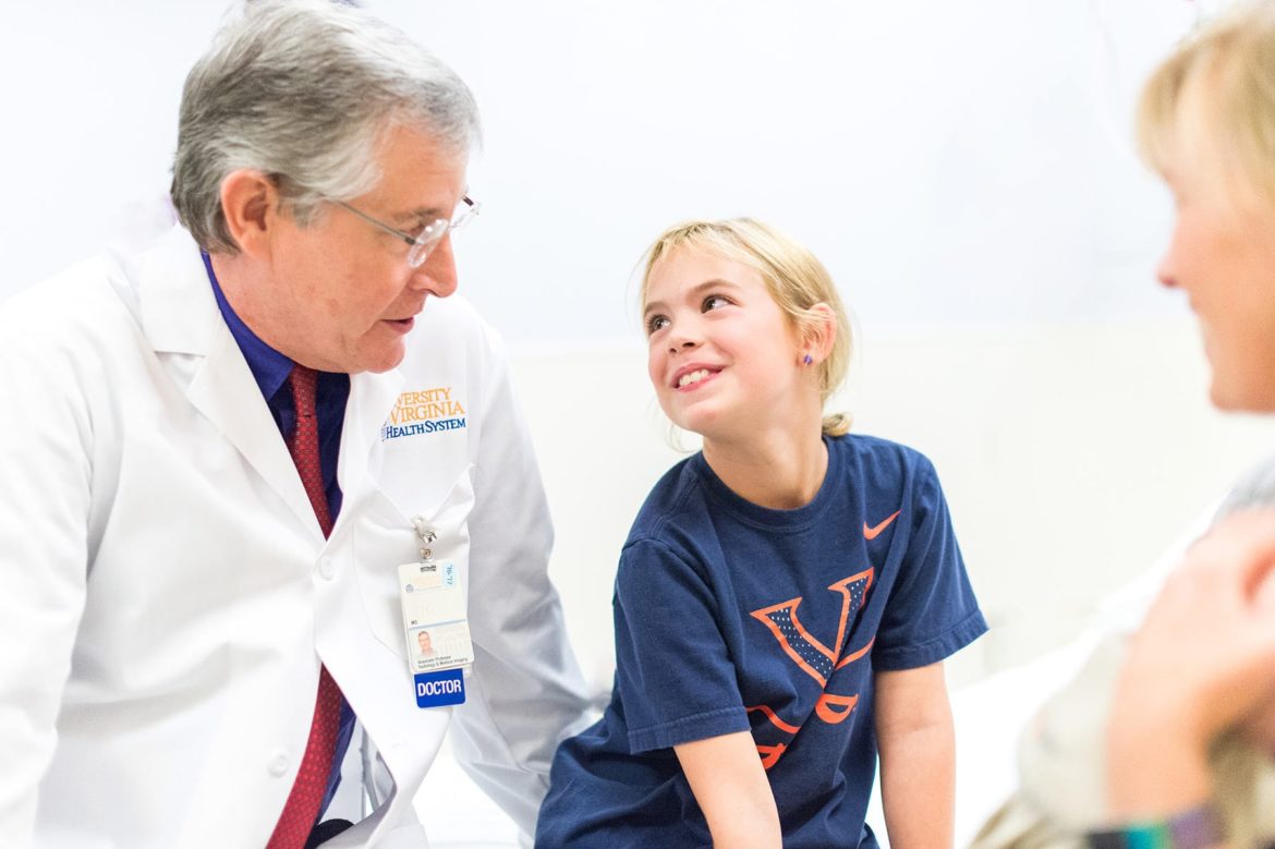 UVA pediatric radiologist meets with a girl and her mother