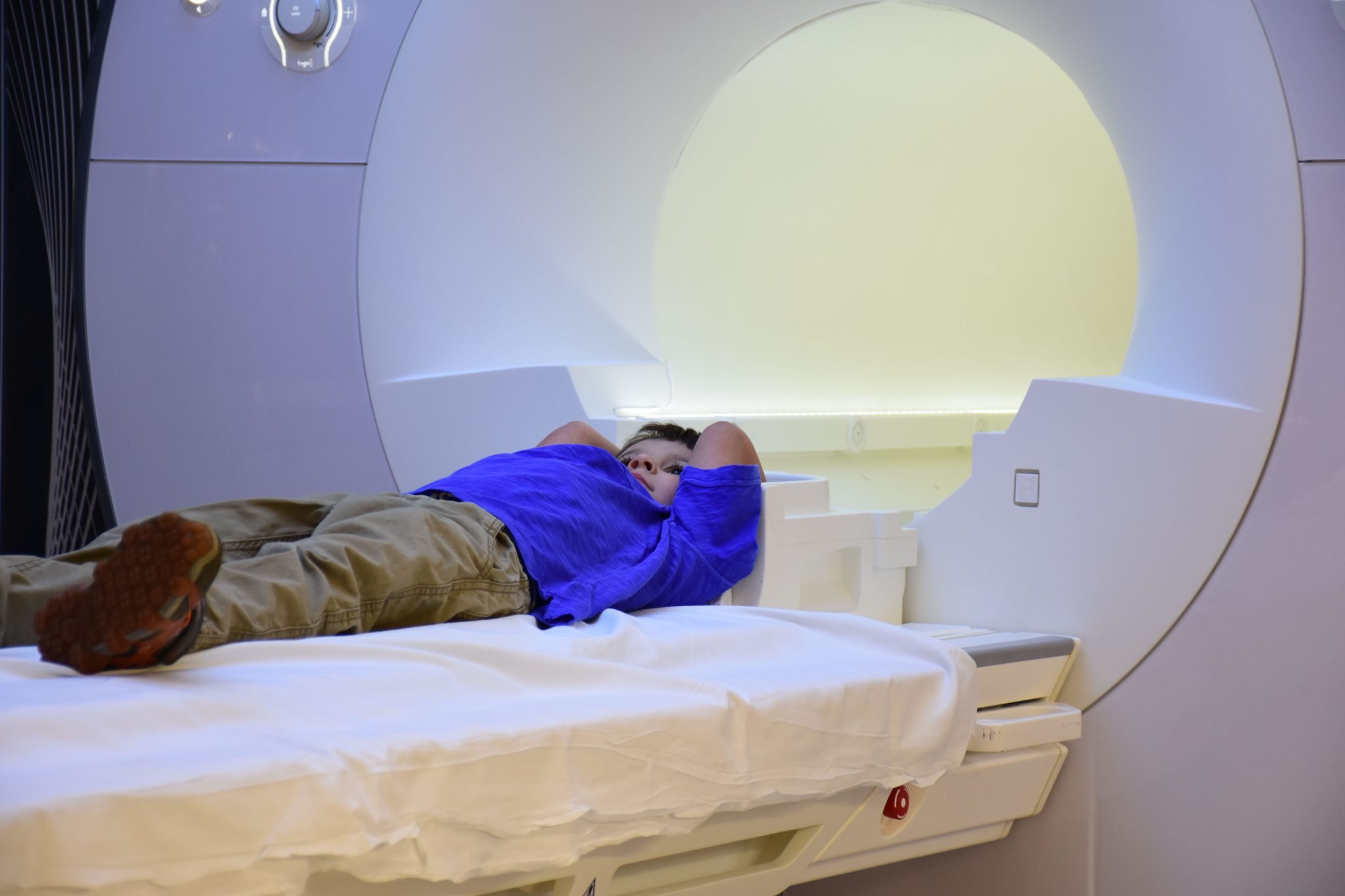 A boy gets an MRI exam