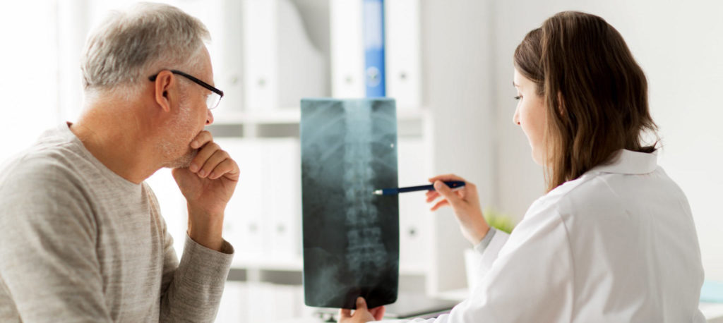 Waiting for imaging test results - doctor and patient look at imaging test results together
